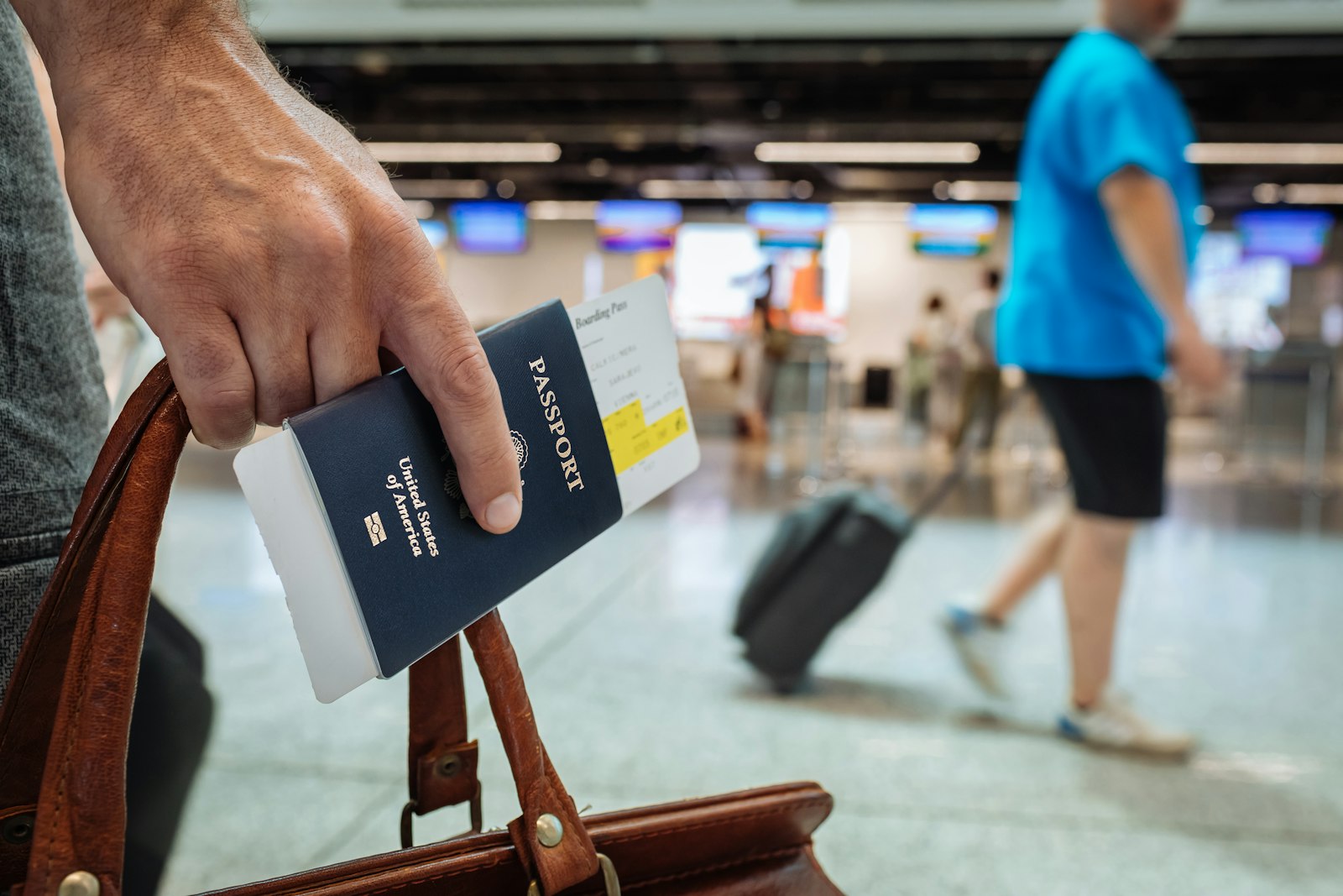 Family arriving at a U.S. airport with luggage, looking ahead with optimism